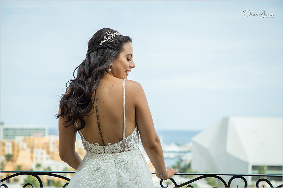 bride on balcony in dress