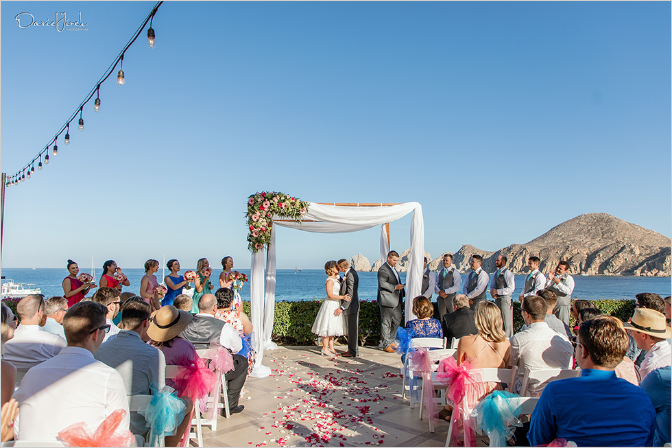 Cabo wedding photography Casa Dorada, destination wedding ceremony, bridal party, first kiss